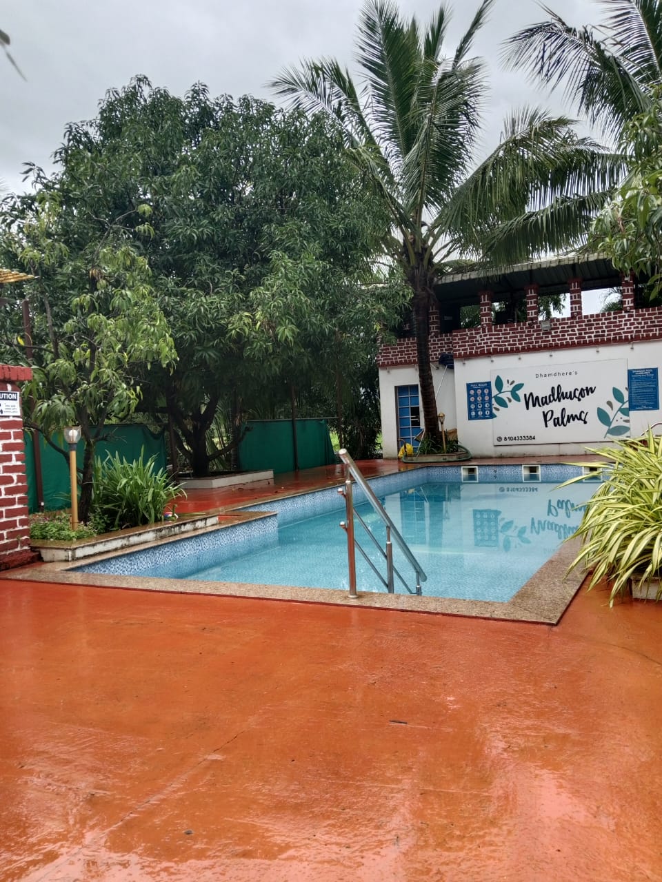 Swimming pool at Madhuson Palms family homestay in Karjat